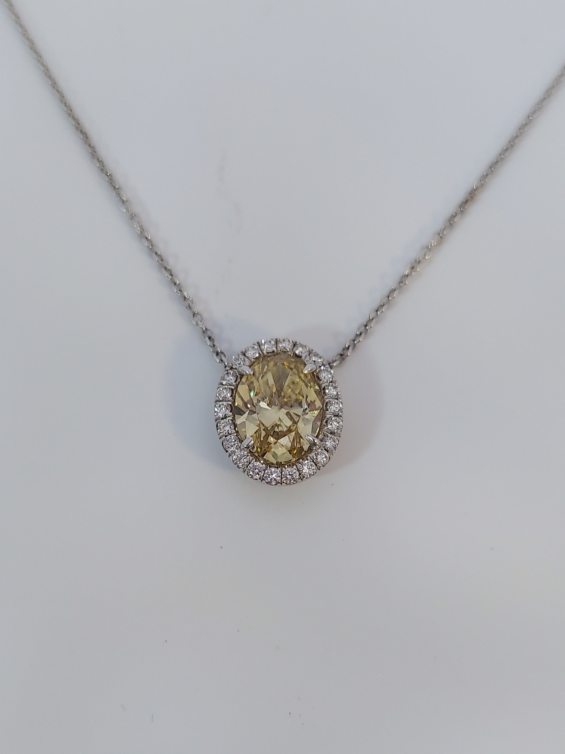 Fancy Yellow Oval Cut Diamond Halo Pendant